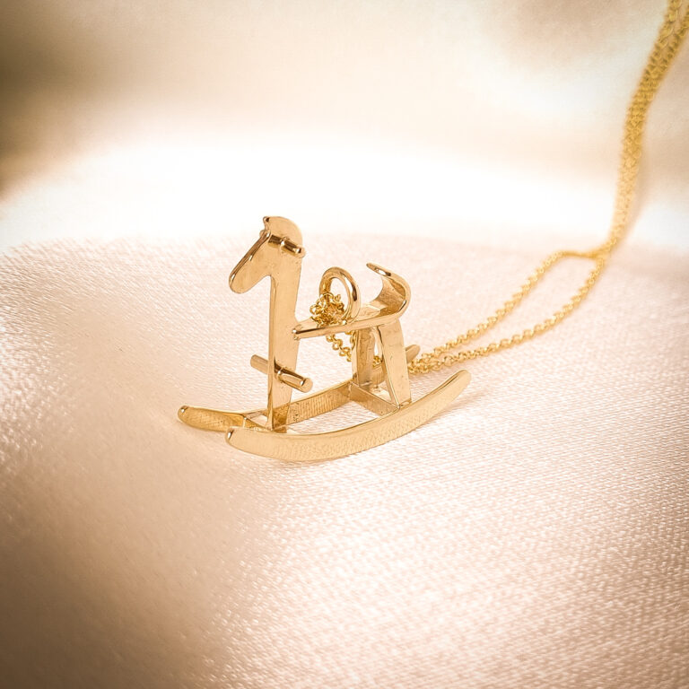 9k yellow gold rocking horse pendant inspired by a childhood keepsake