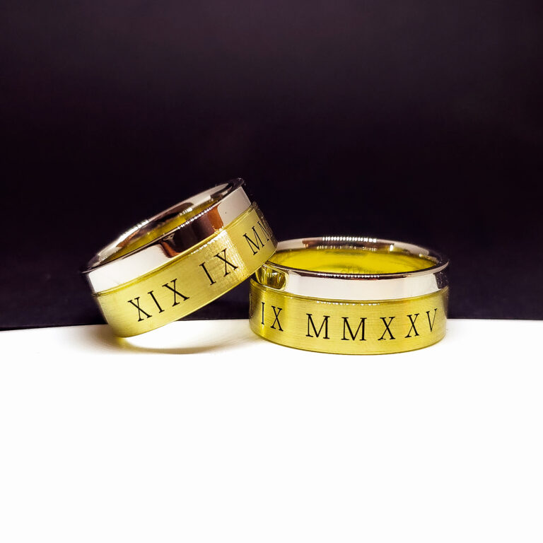 Men’s platinum and 14k yellow gold wedding bands with Roman numeral date engraving