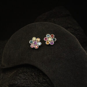 Silver stud earrings set with multi-colour gemstones including topaz, peridot, citrine, garnet and amethyst in a cluster design