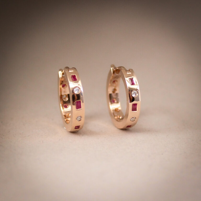 9k rose gold hoop earrings set with baguette rubies and round diamonds in a matching set design